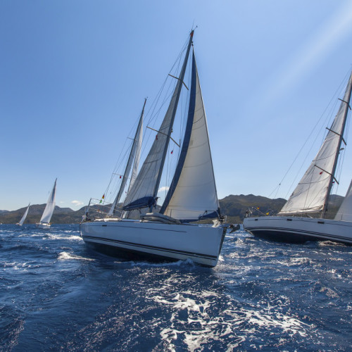 Sailing yacht race. Sailing ships yachts with white sails in the